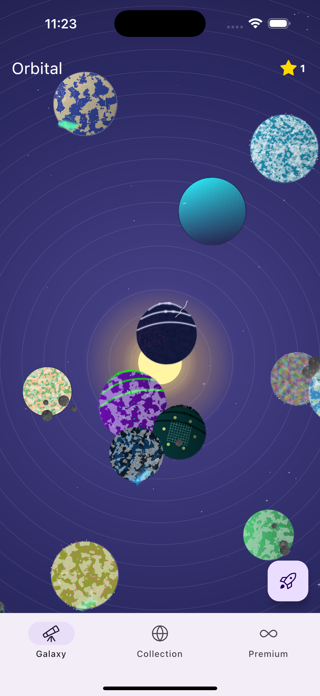 Orbital app galaxy view showing diverse colorful planets including blue earth-like, cyan, purple spotted, and green planets with orbital rings spinning against deep space background